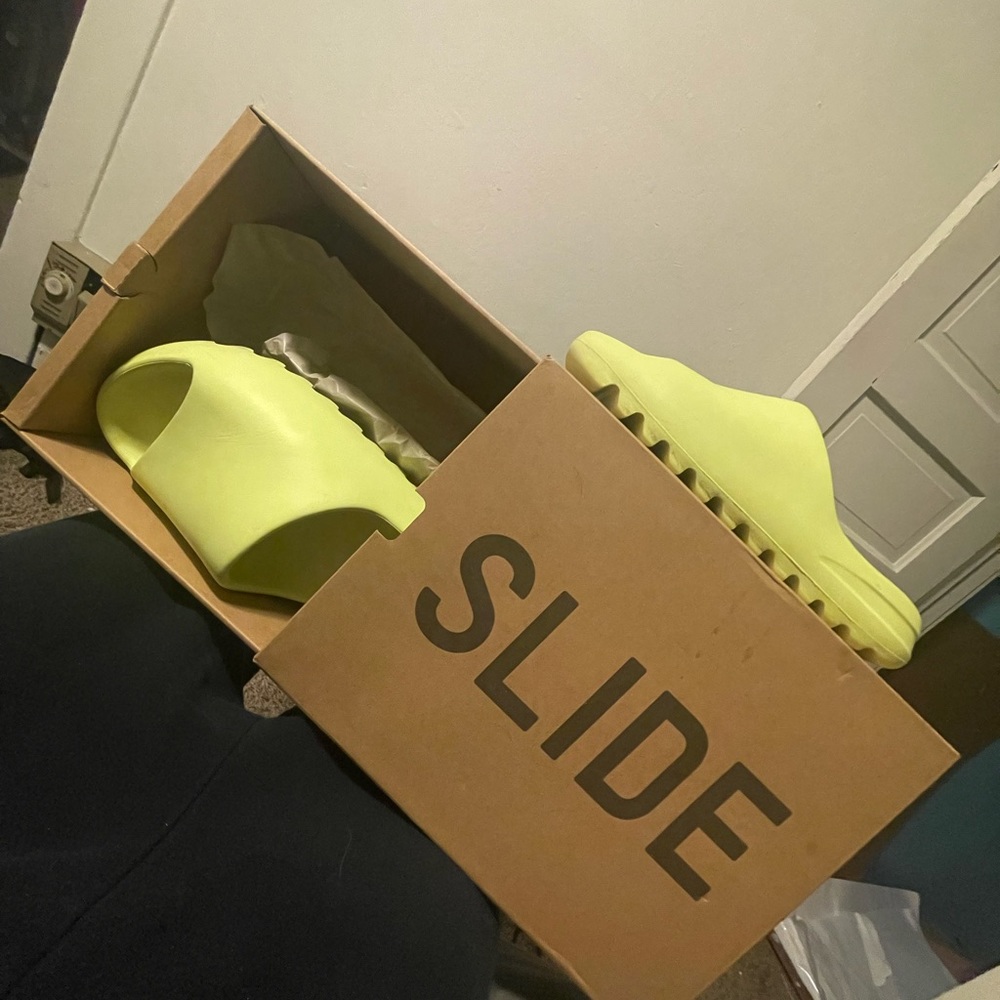 These are Neon Yellow Yeezy Slides in a size 10 worn a few times still clean
